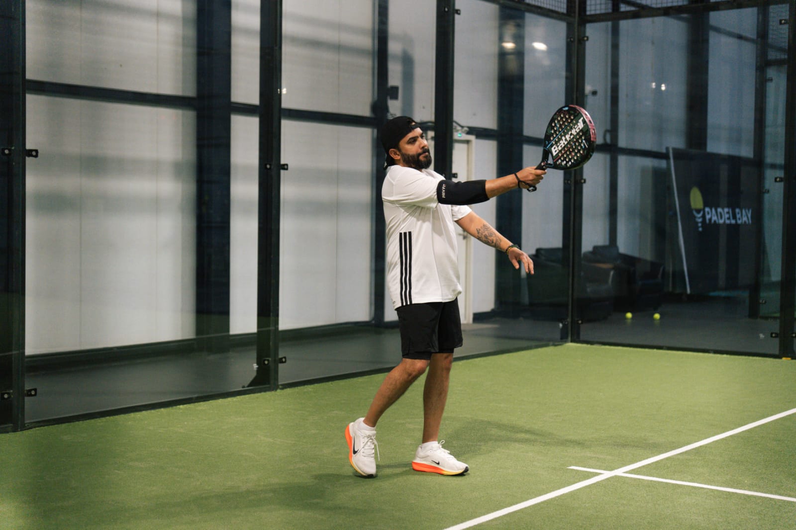 Punit Karelia playing padel during the tournament