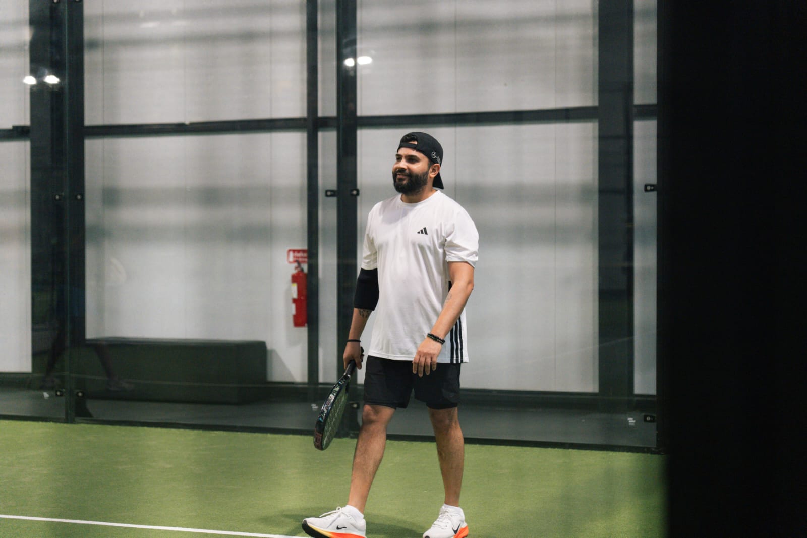 Punit Karelia in action on the padel court