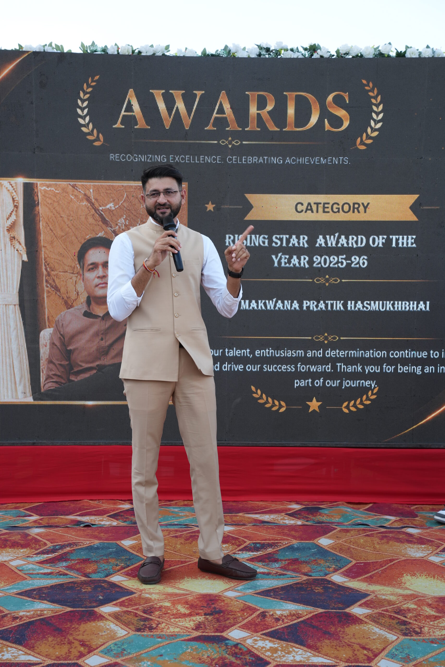 Hiren Bathani speaking at an awards event